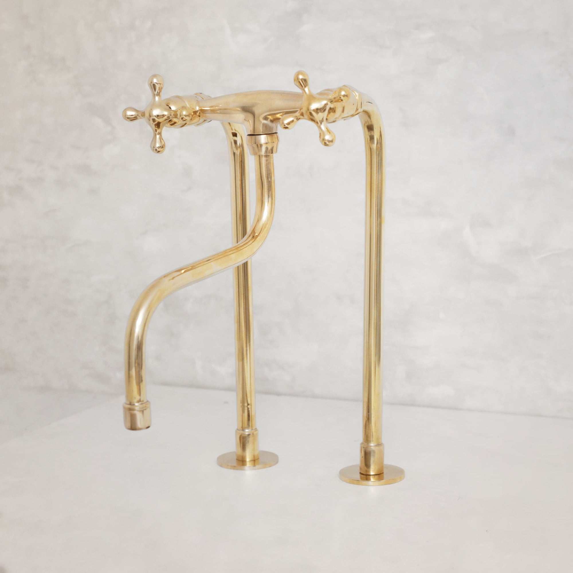 Elegant Unlacquered Brass Kitchen Faucet with Tall Legs and Unique Elephant Trunk Spout - BRASSMA