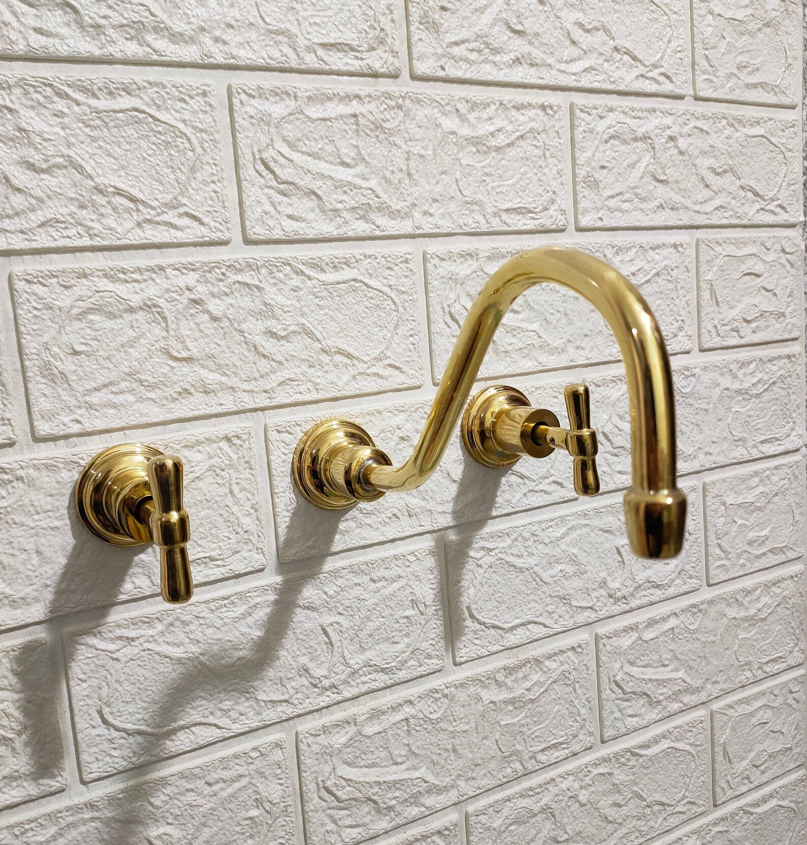 Unlacquered Brass Wall Mount Faucet With Curved Spout