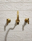 Unlacquered Brass Wall Mount Faucet With Curved Spout