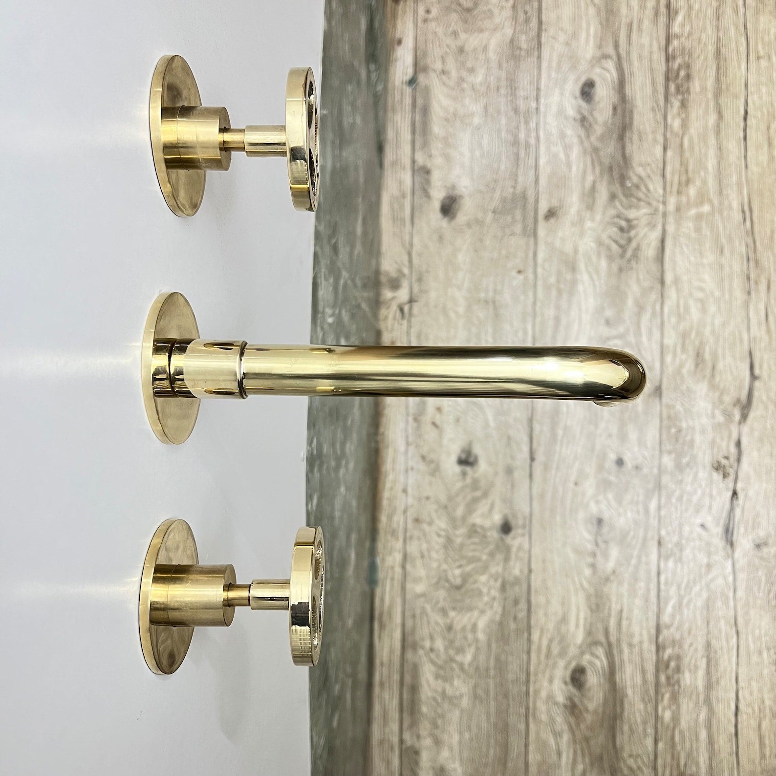 Unlacquered Brass Wall Mounted Faucet With Wheel Handles