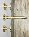 Unlacquered Brass Wall Mounted Faucet With Wheel Handles