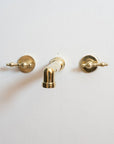 Unlacquered Brass Wall Mounted Faucet With Lever Handles