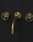 Unlacquered Brass Wall Mounted Faucet With Round Handles