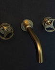 Unlacquered Brass Wall Mounted Faucet With Round Handles